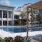 a cabana next to a swimming pool