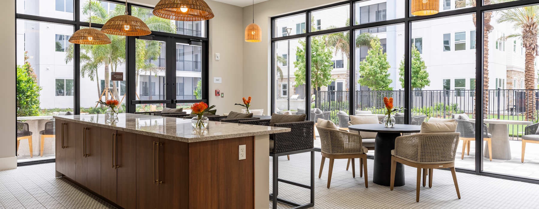 large windows surround clubroom kitchen